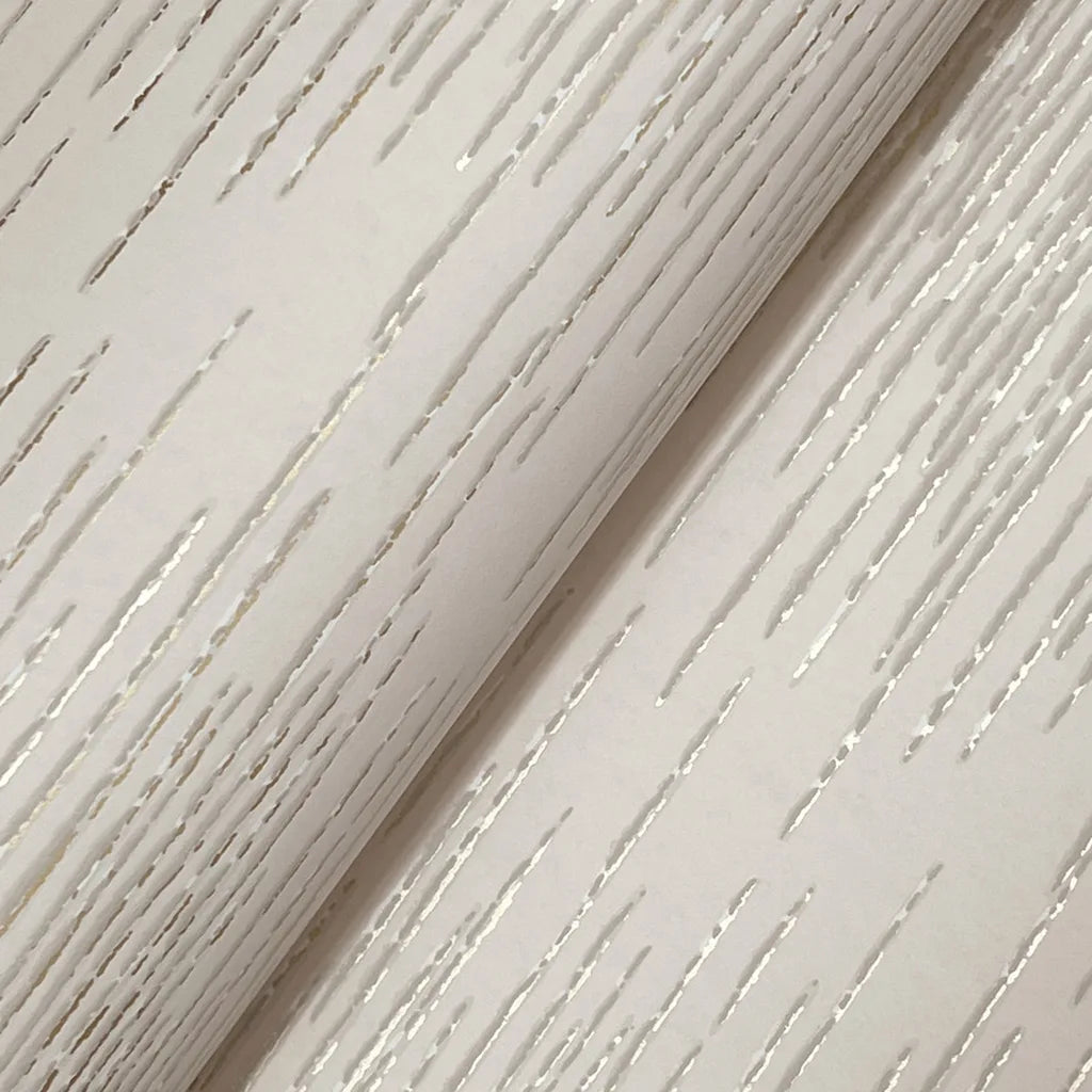 Intricate close-up texture detail of York Wallcoverings' Operetta wallpaper in elegant beige and gold.
