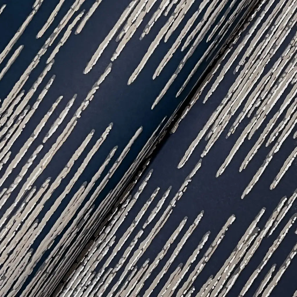 Close-up texture detail of York Wallcoverings' "Operetta" wallpaper in Navy Blue and Taupe.