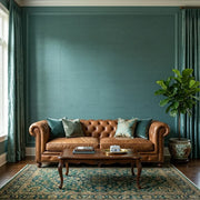 Living Room - Modern living room featuring stunning teal 'Painted Hemp' wallpaper by York Wallcoverings, creating a serene and stylish space.