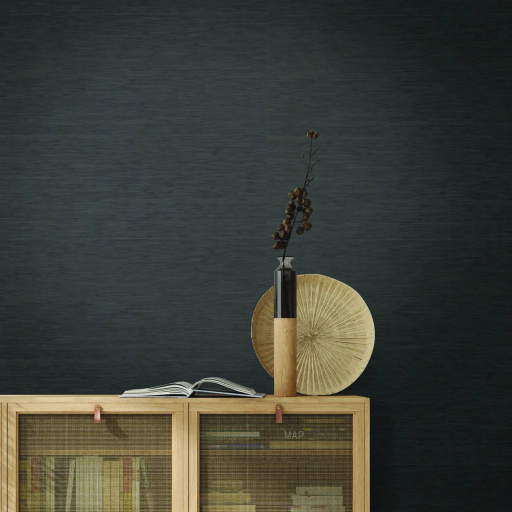 Modern living room showcasing York Wallcoverings' 'Painted Hemp' wallpaper in Charcoal, adding sophisticated texture to the space.