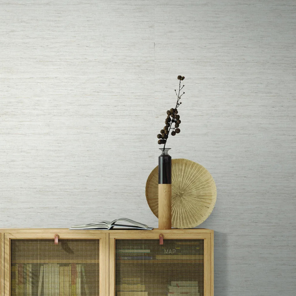 Elegant living room featuring York Wallcoverings' Pale Beige 'Painted Hemp' wallpaper, creating a serene, natural ambiance.