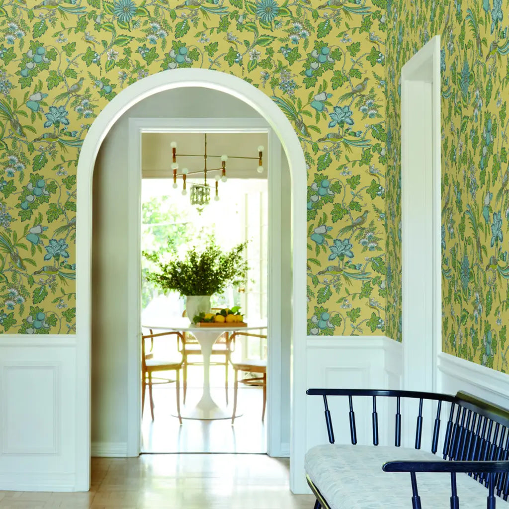 Bright entryway showcases elegant 'Parterre' wallpaper in Yellow and Green by York Wallcoverings, adding a fresh, inviting touch.
