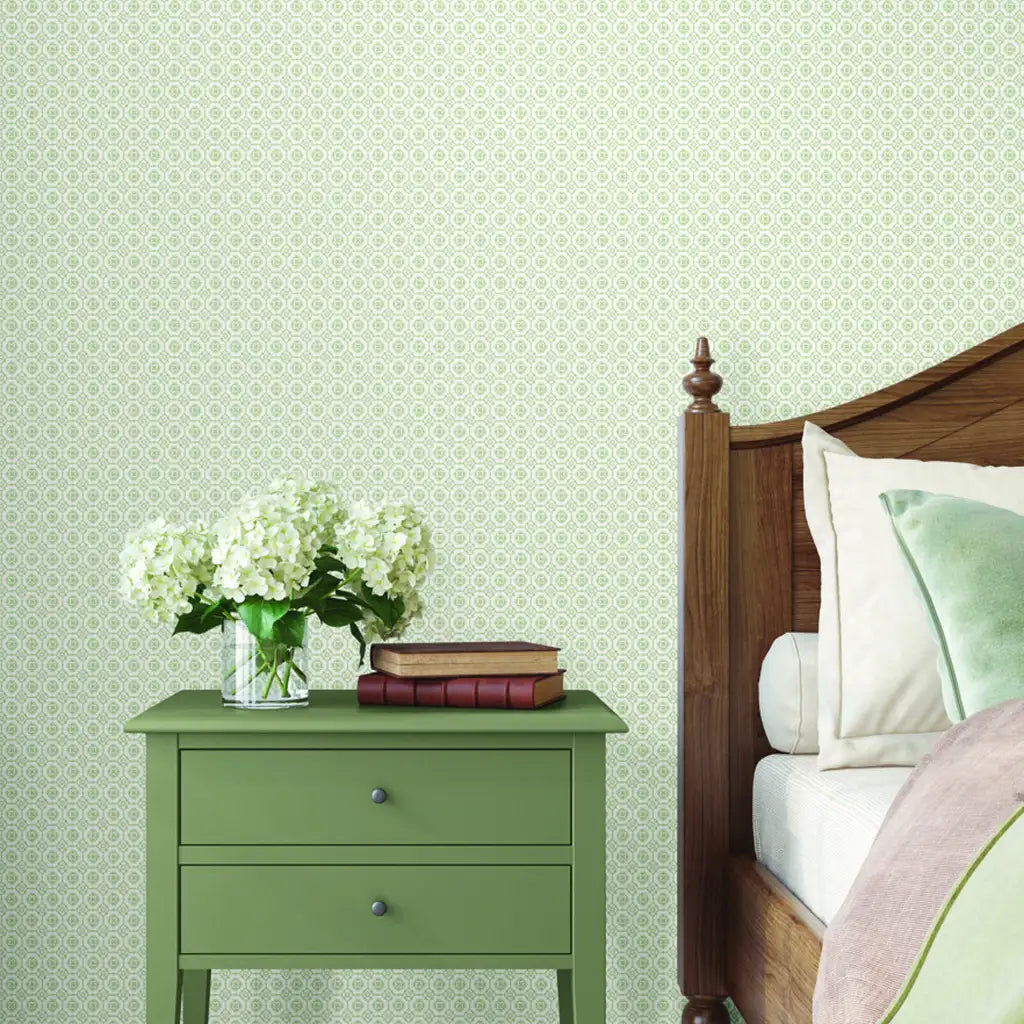 Stylish bedroom with Priti green and white wallpaper from York Wallcoverings.