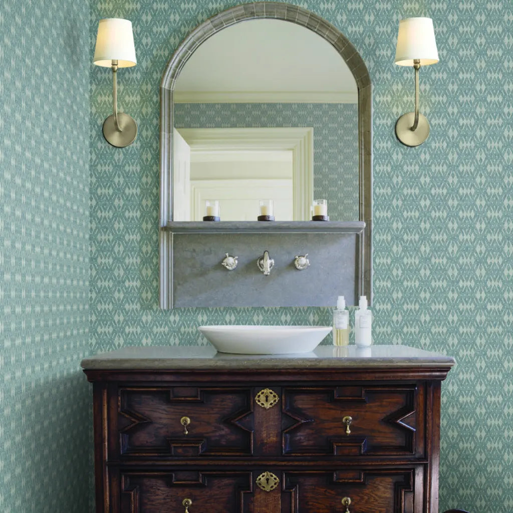 Elegant bathroom features 'Radcliffe' wallpaper in Light Blue-Grey by York Wallcoverings, creating a serene, stylish space.