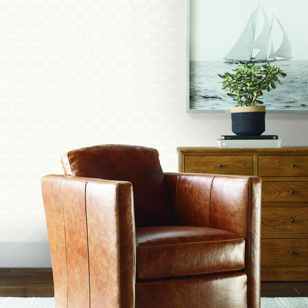 Living room showcasing elegant 'Radcliffe' wallpaper in Warm Ivory by York Wallcoverings, creating a serene and stylish space.