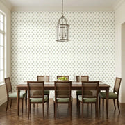 Dining Room - Elegant space showcasing York Wallcoverings' 'Serene Villa' wallpaper in a beautiful green, pink, and white pattern.