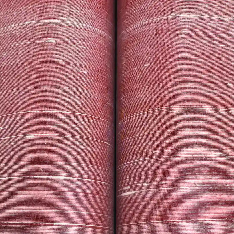 Close-up detail of the subtle texture and rich pattern of York Wallcoverings' Silk Road Terracotta wallpaper.