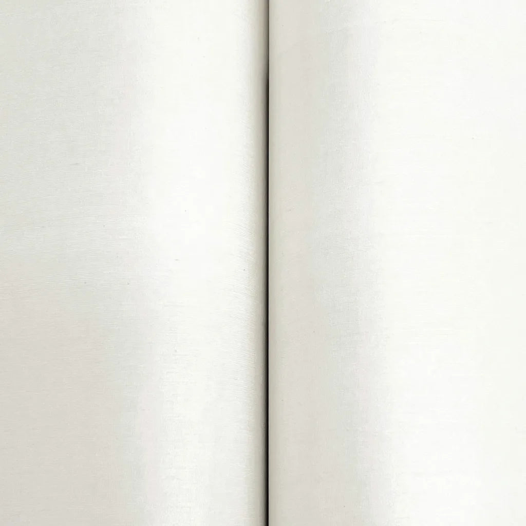 Close-up texture detail of York Wallcoverings Silk Road wallpaper in Warm Ivory, highlighting its luxurious, subtle pattern.