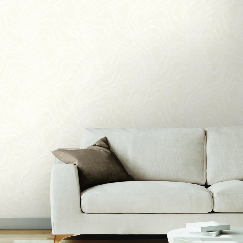 Warm Ivory String of Pearls wallpaper by York Wallcoverings adorns this elegant living room, adding sophisticated texture.