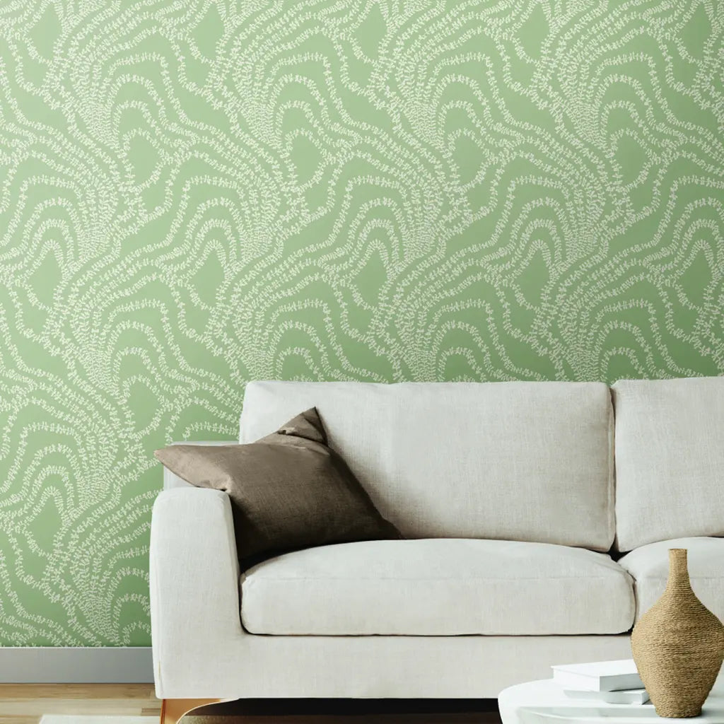 Modern living room with elegant Sage Green "String of Pearls" wallpaper by York Wallcoverings, adding botanical charm.