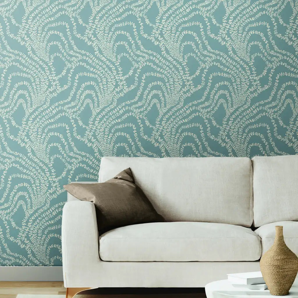 Elegant living room featuring 'String of Pearls' wallpaper in Dusty Blue by York Wallcoverings.