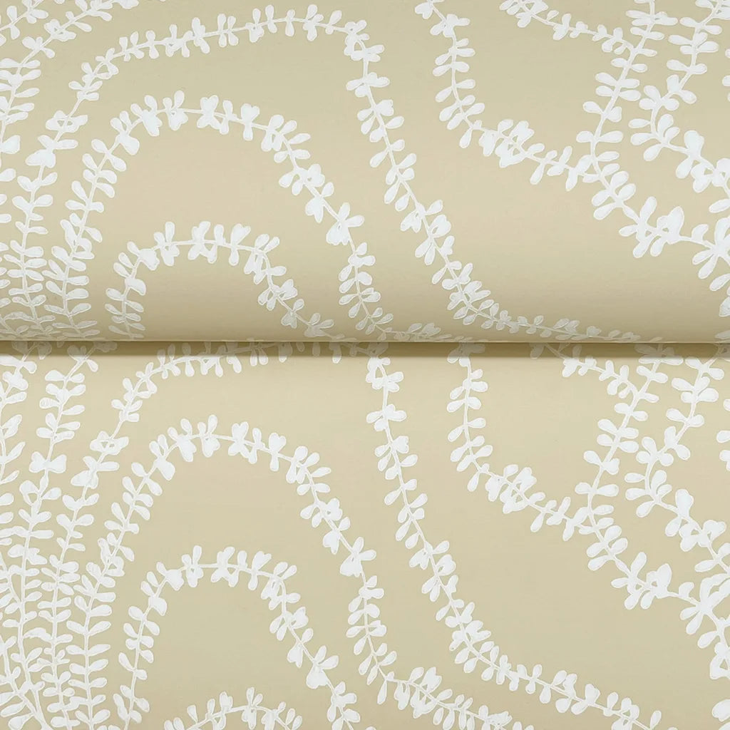 Close-up texture of York Wallcoverings' Warm Beige 'String of Pearls' wallpaper, highlighting its unique beaded design.
