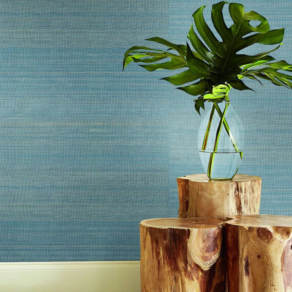 Elegant living room showcases York Wallcoverings' Tailored Abaca wallpaper in serene Dusty Blue, enhancing sophisticated decor.