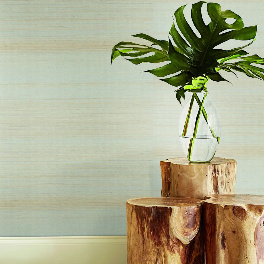 Warm Ivory 'Tailored Abaca' wallpaper by York Wallcoverings enhances this inviting living room with natural texture and subtle elegance.