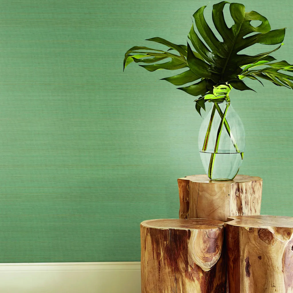 Modern living room design showcases elegant York Wallcoverings 'Tailored Abaca' wallpaper in Muted Teal, adding sophisticated texture.