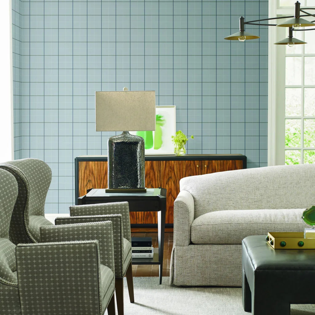 Cozy living room featuring elegant Light Grey Tattersall wallpaper by York Wallcoverings, enhancing the room's sophisticated style.