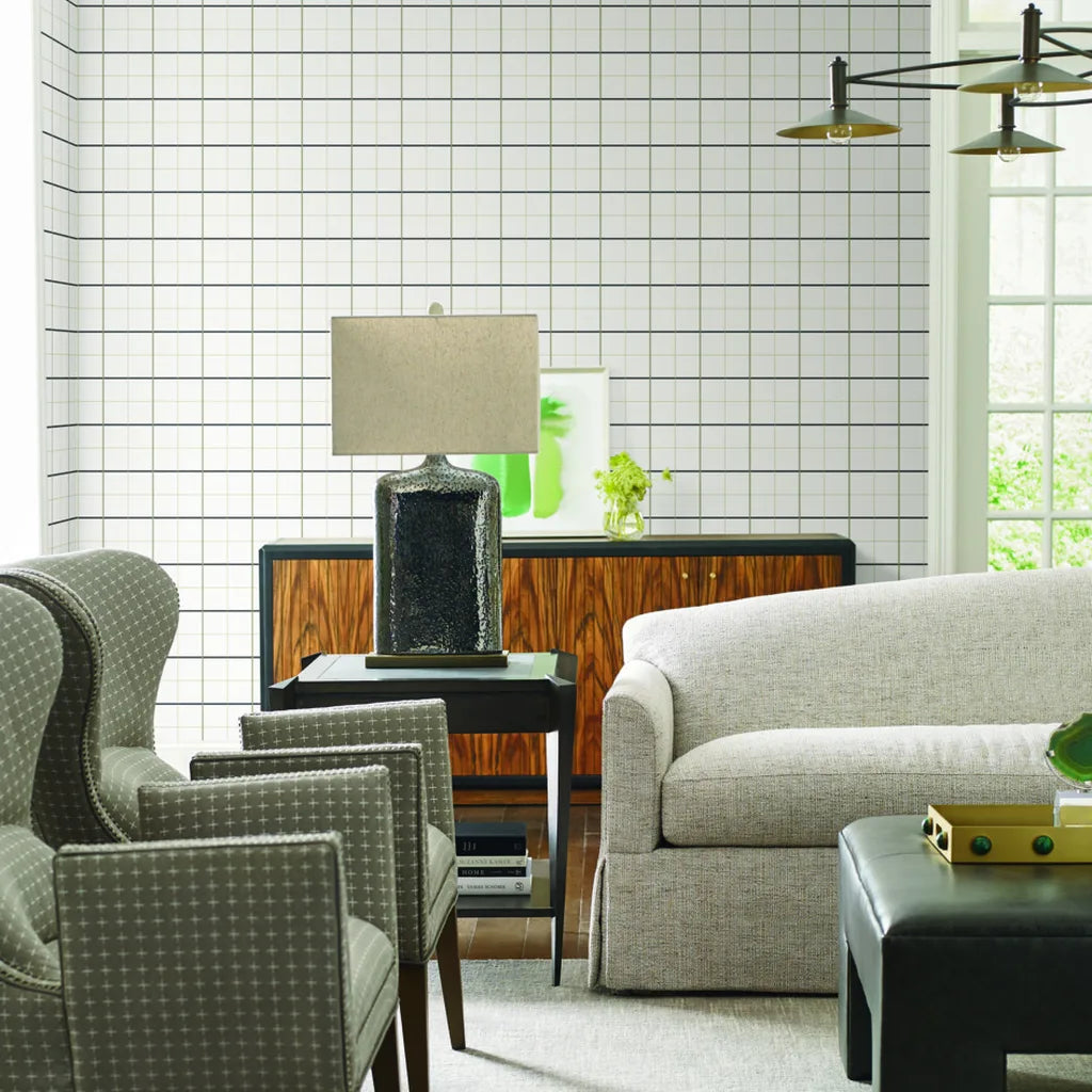 Sophisticated living room featuring Tattersall wallpaper in Charcoal and Taupe from York Wallcoverings.