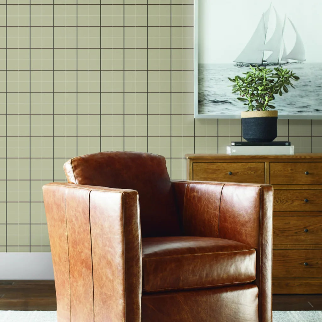 Cozy living room features classic Tattersall wallpaper in Beige and Brown by York Wallcoverings, enhancing interior design.