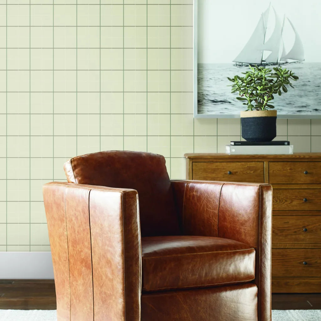 Living room design with Tattersall wallpaper in beige and grey by York Wallcoverings, adding classic style and warmth.