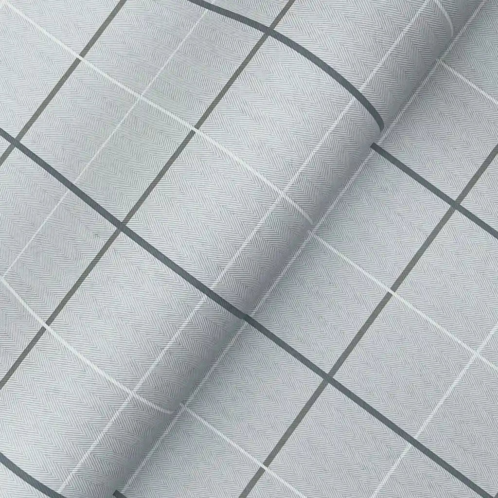 Close-up texture detail of York Wallcoverings' Tattersall light grey wallpaper, revealing its subtle woven fabric pattern.