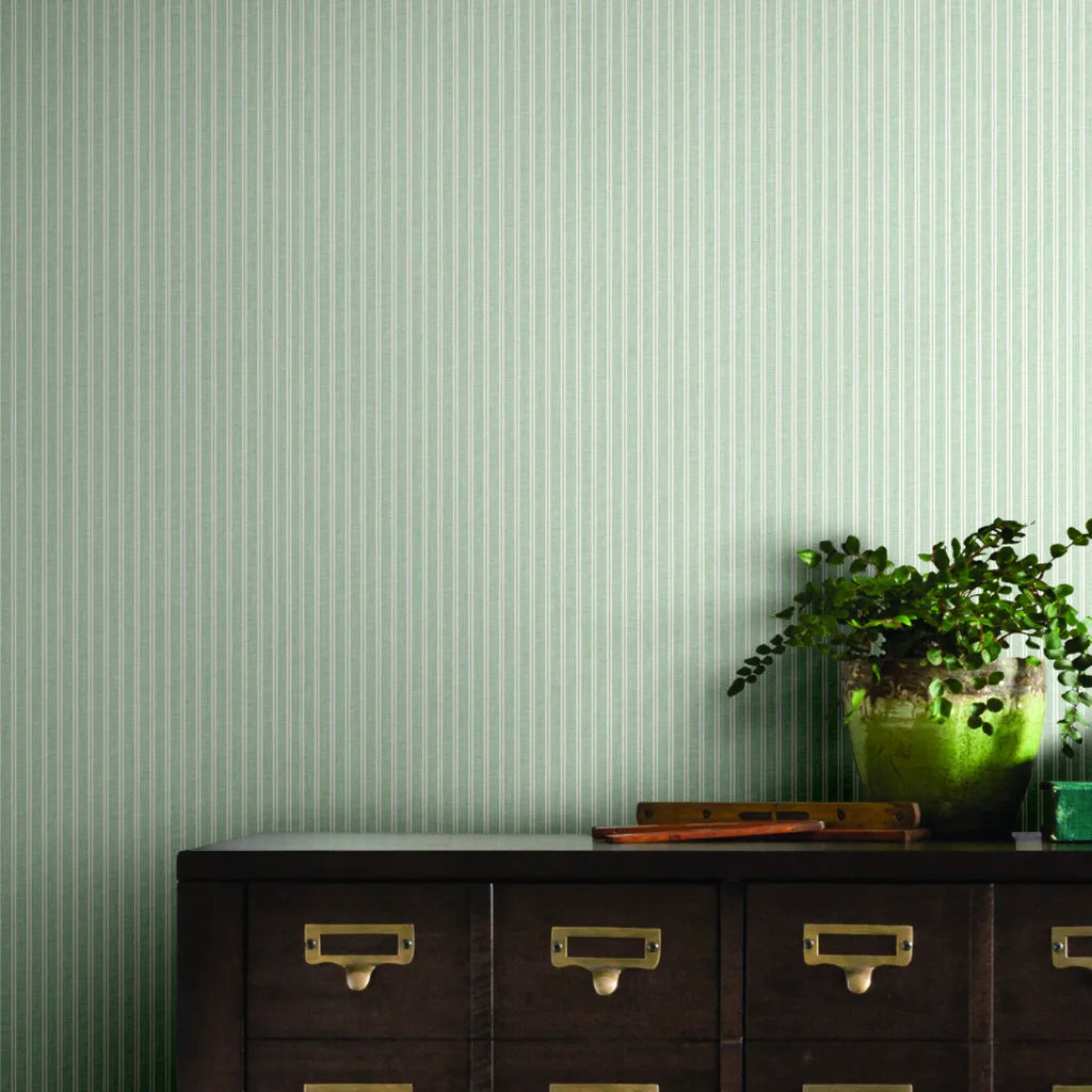 Home office featuring serene Sage Green Ticking Stripe wallpaper by York Wallcoverings, creating a stylish and calm workspace.