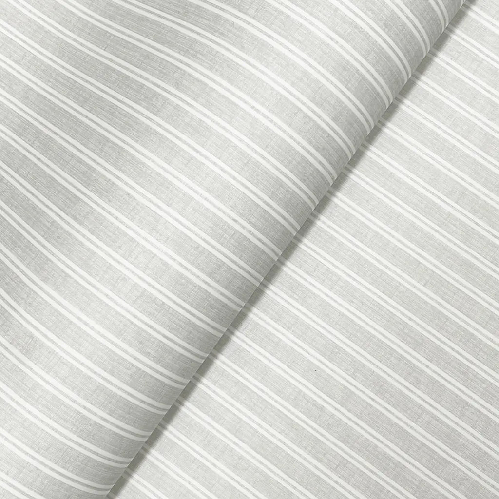 Macro view of York Wallcoverings' Ticking Stripe wallpaper in Grey and Cream, revealing its subtle textile texture.