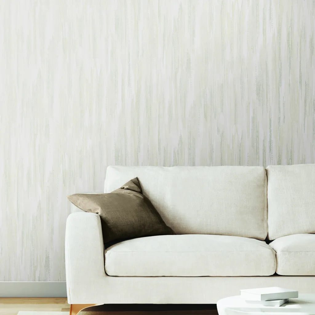 Living room features elegant Tribeca wallpaper in Warm Ivory by York Wallcoverings, creating a serene, stylish space.