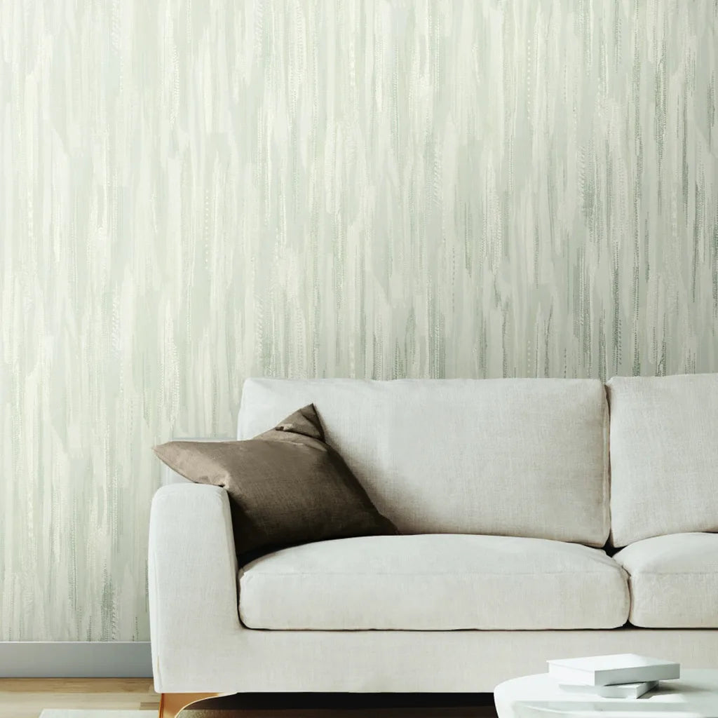 Living room showcasing elegant Tribeca wallpaper in Warm Ivory by York Wallcoverings, creating a serene and stylish space.