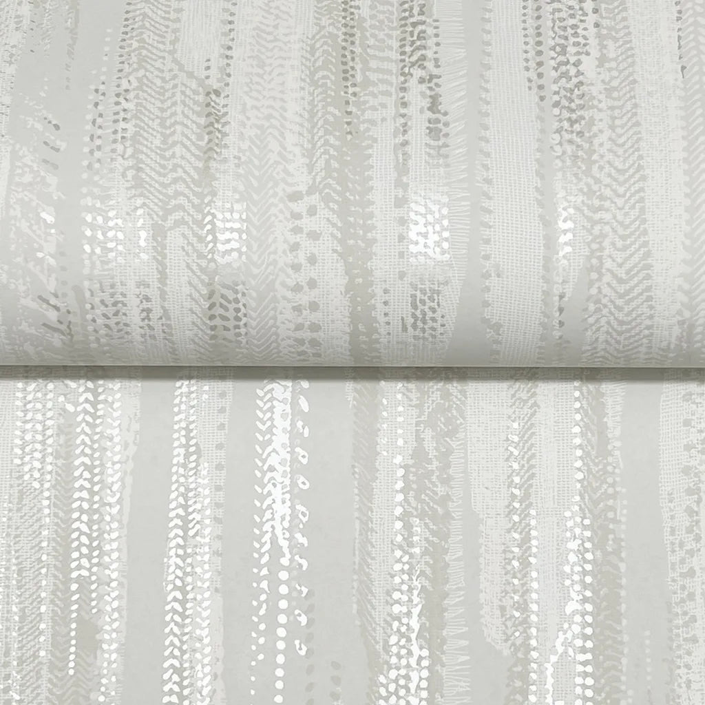 Close-up of Tribeca wallpaper by York Wallcoverings in Warm Ivory, revealing its elegant, finely woven texture.