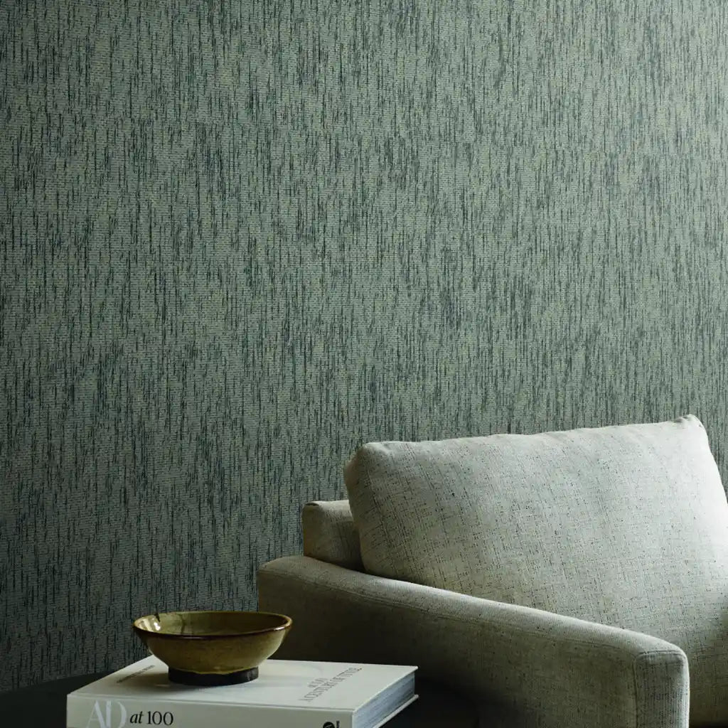 Elegant living room with York Wallcoverings' Twist Paperweave wallpaper in sophisticated Greige and Charcoal tones.