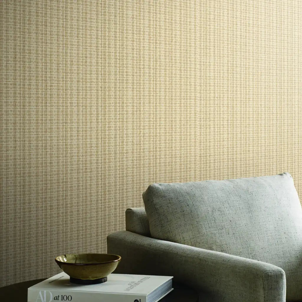 Living room photo featuring 'Twist Paperweave' wallpaper in Warm Beige by York Wallcoverings, creating a serene space.