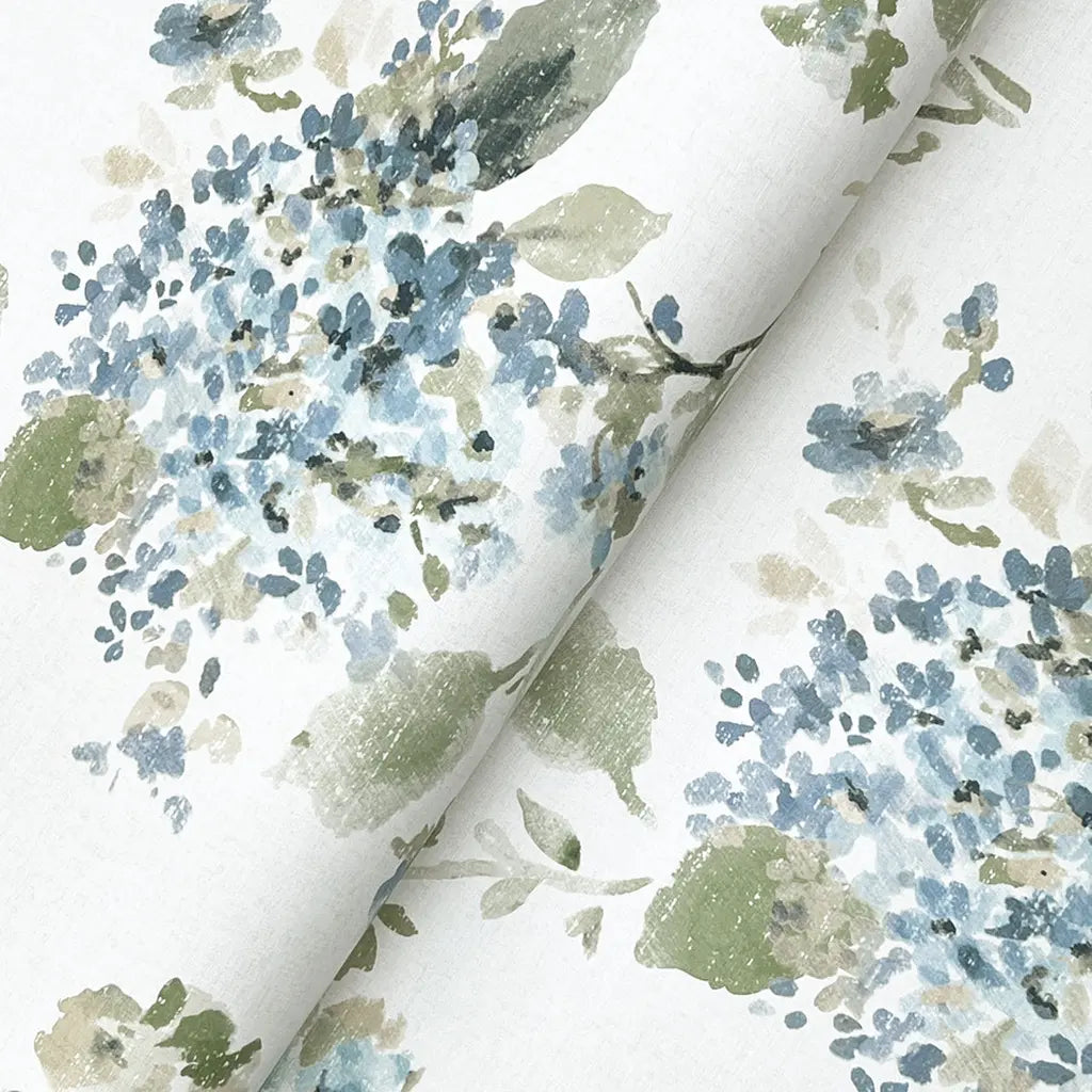 Close-up texture detail of York Wallcoverings' 'Veiled Garden' wallpaper in Blue, Green, Cream, highlighting its intricate pattern.