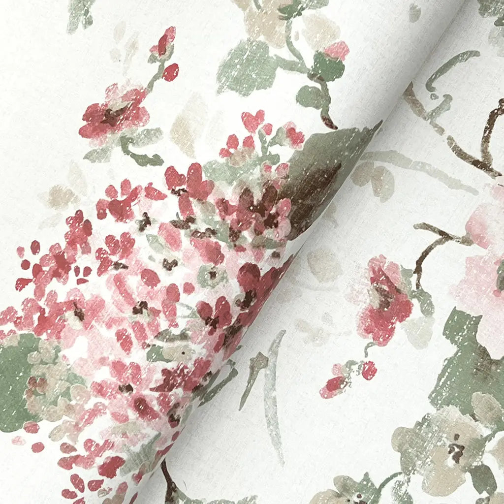 Close-up texture detail of York Wallcoverings' Veiled Garden wallpaper in Rose, Pink, Green, and Cream, highlighting intricate patterns.