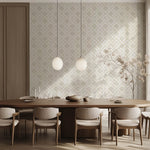 A modern dining room exuding contemporary style features a long wooden table surrounded by upholstered chairs. Two pendant lights hover above, enhancing the chic ambiance. The walls are adorned with the Paradox Geometric Wallpaper Mural by Decor2Go Wallpaper Mural, while a branch with delicate leaves graces the corner, completing the custom-fit solution.