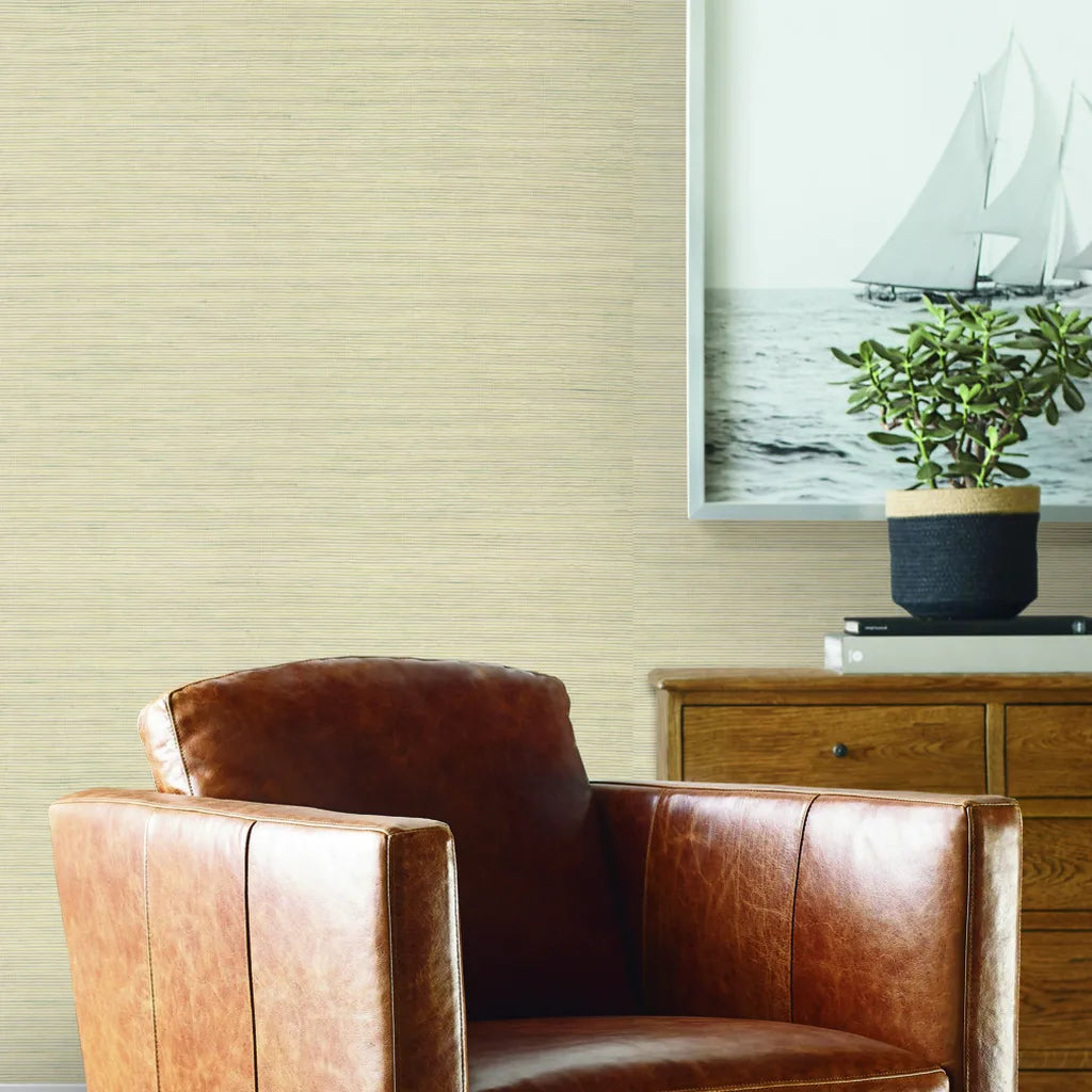 Warm Ivory Warwick wallpaper by York Wallcoverings adds serene elegance and texture to this stylish living room.