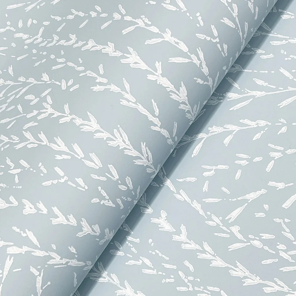 Close-up texture of 'Willow Song' wallpaper by York Wallcoverings, featuring intricate blue and cream botanical details.