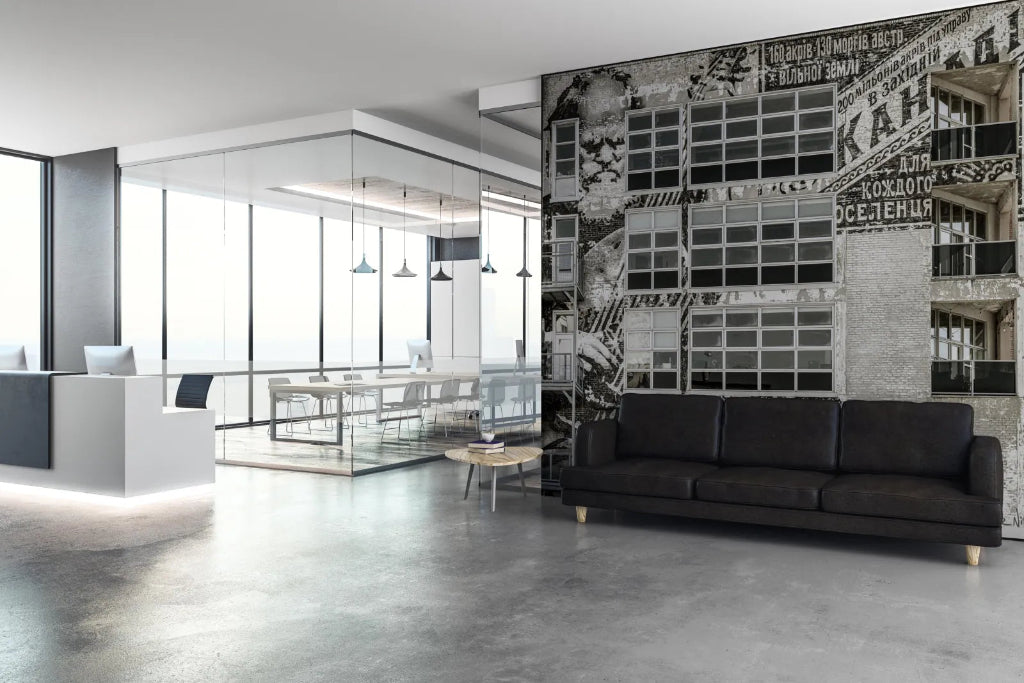 Office - Modern office interior with a black sofa and decorative wall.