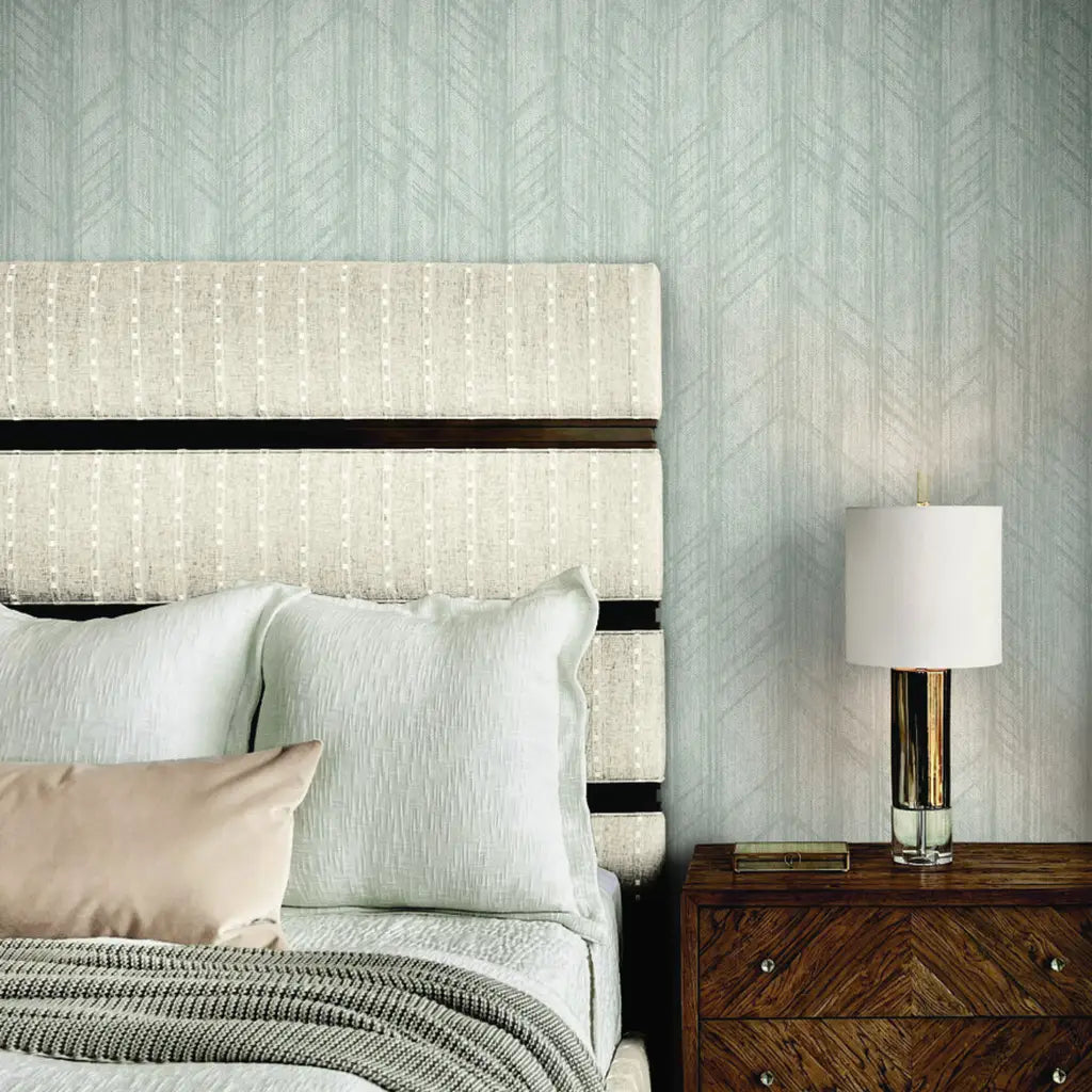 Light Grey Winthrop wallpaper by York Wallcoverings enhances this elegant bedroom design.