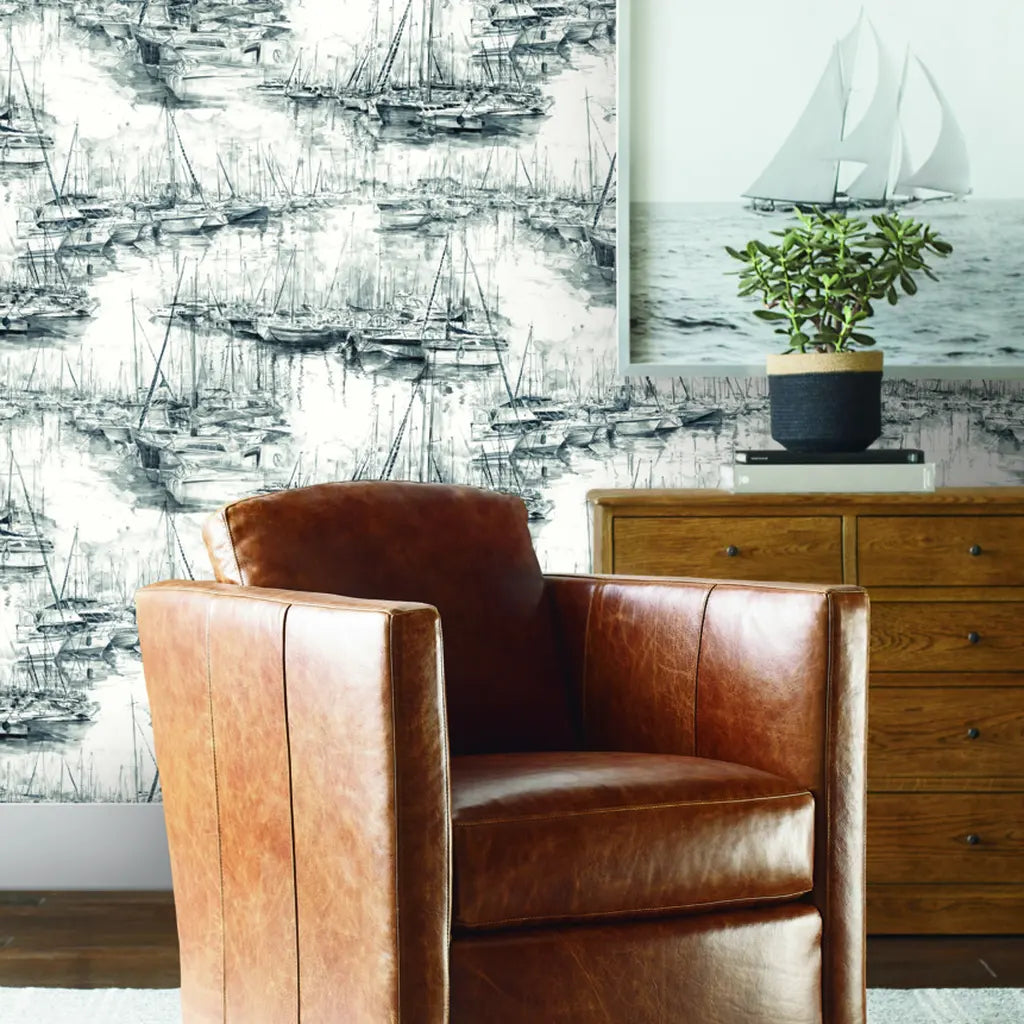 Black and White 'Yacht Club' wallpaper by York Wallcoverings adds sophisticated nautical style to a modern living room.