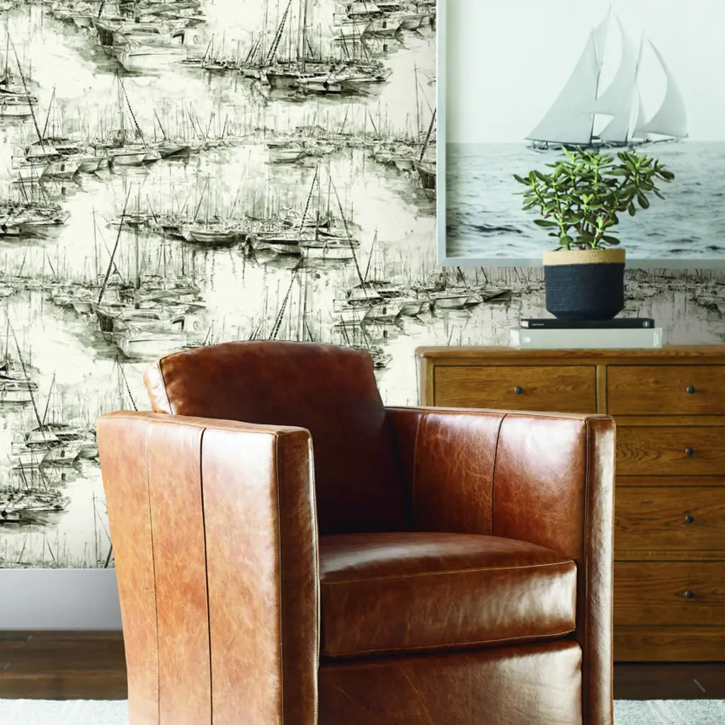 Modern living room features elegant Yacht Club wallpaper in Charcoal and Cream by York Wallcoverings.