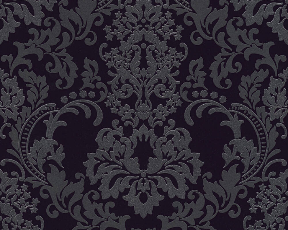 The Black Baroque Black Wallpaper by Ontario showcases a classic Baroque design with a dark, ornate damask pattern adorned with intricate floral and leaf motifs. Its symmetrical layout highlights elegant curves and flourishes on a deep black background, enhancing the sophisticated contrast of this textured wallpaper.