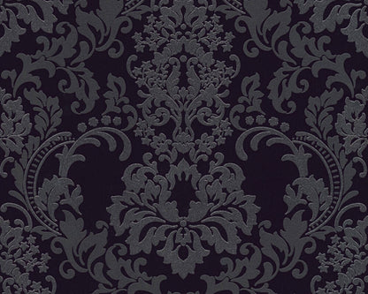 An intricate, dark grey damask ornament with floral and ornamental motifs on a black background. The design features detailed, symmetrical foliage and curling vines, creating a sophisticated and classic Baroque design. This Ontario Baroque Black Wallpaper exudes timeless elegance.