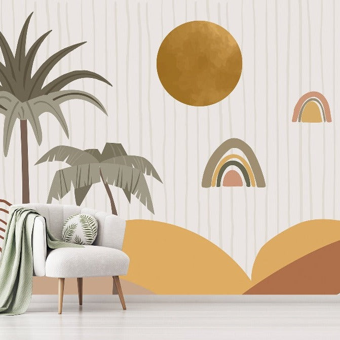 A modern kids' bedroom with abstract Rainbow Wonders Wallpaper Mural from Decor2Go featuring geometric shapes in earth tones. There's a stylish chair with a throw and a cushion next to a rattan side table, and decorative plants enhance the décor.