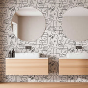 Bathroom - Modern bathroom interior with twin sinks and mirrors against a feature wall decorated with Decor2Go Wallpaper Mural of abstract faces. Light wood cabinetry adds warmth to the design.