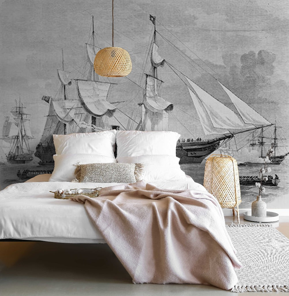 Bedroom - A modern bedroom with a maritime theme inspired by pirate stories, featuring a large wall mural of vintage ships, a white bed with plush linens, and pendant lighting, complemented by natural textures and soft Decor2Go Wallpaper Mural Sailing Away Wallpaper Mural.