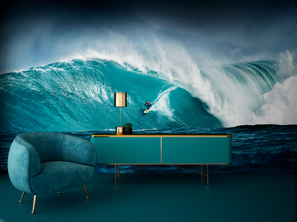 A surreal living room where a large ocean wave with a Decor2Go Wallpaper Mural dominates the background, blending reality with a vivid seascape, against a plush blue sofa and a stylish teal console.